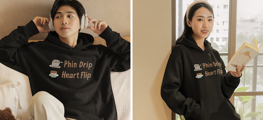 Hero_Image_of_A_Guy_and_A_Girl_Wearing_The_Same_Black_Hoodie_with_Phin_Drip_Heart_Flip_Graphic