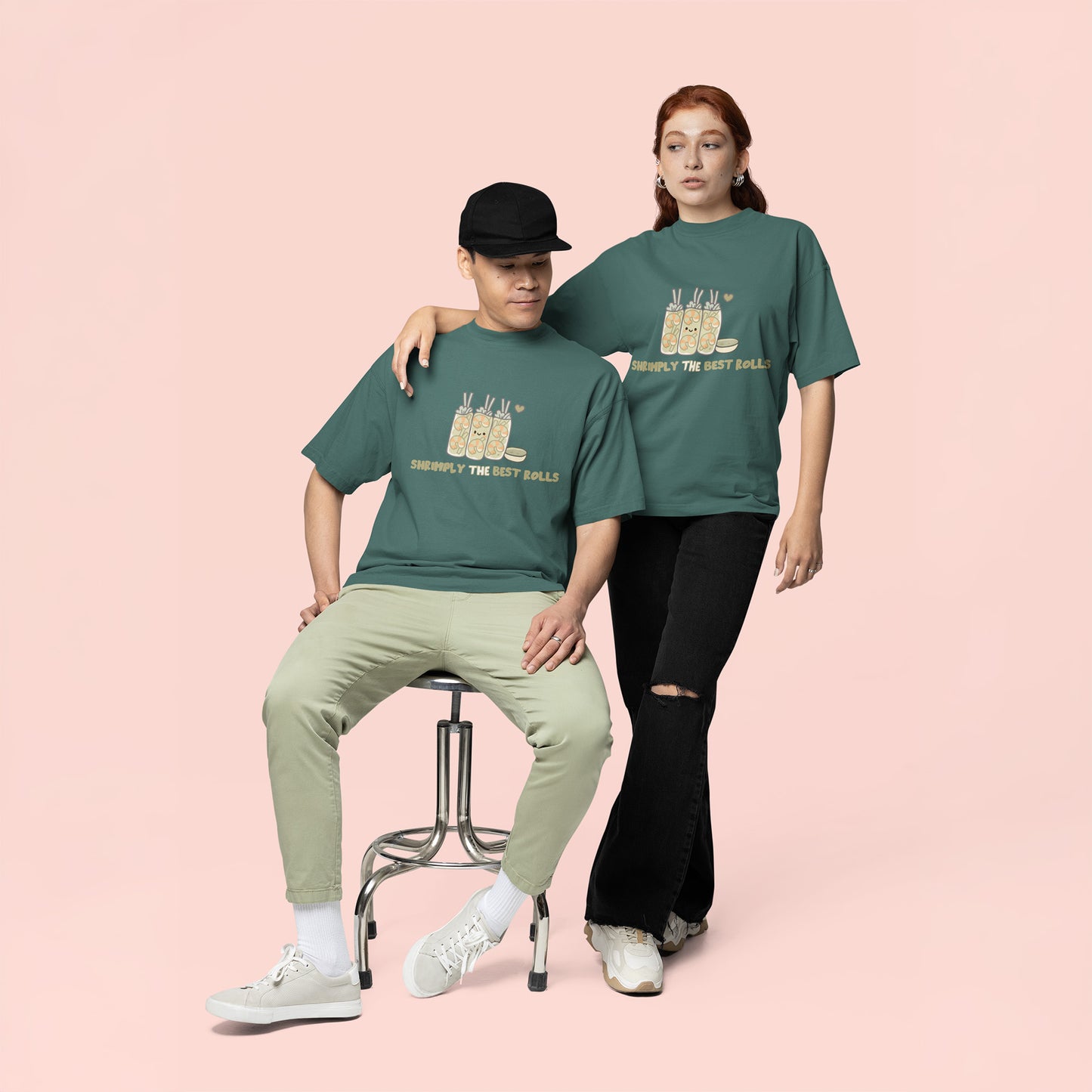 Male and female wearing matching unisex shrimp spring roll graphic t-shirts in blue spruce for teens and young adults, featuring cute foodie streetwear aesthetic.