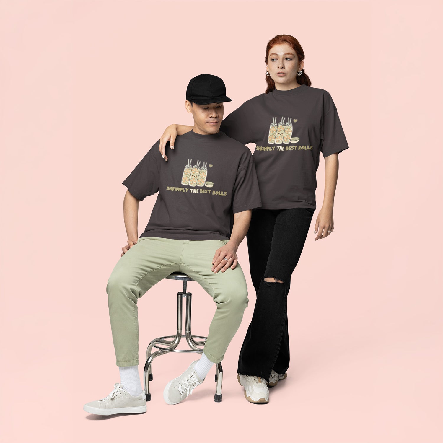 Male and female wearing matching graphite gray kawaii shrimp spring roll graphic tees for young adults featuring oversized unisex fit and cute foodie fashion aesthetic.