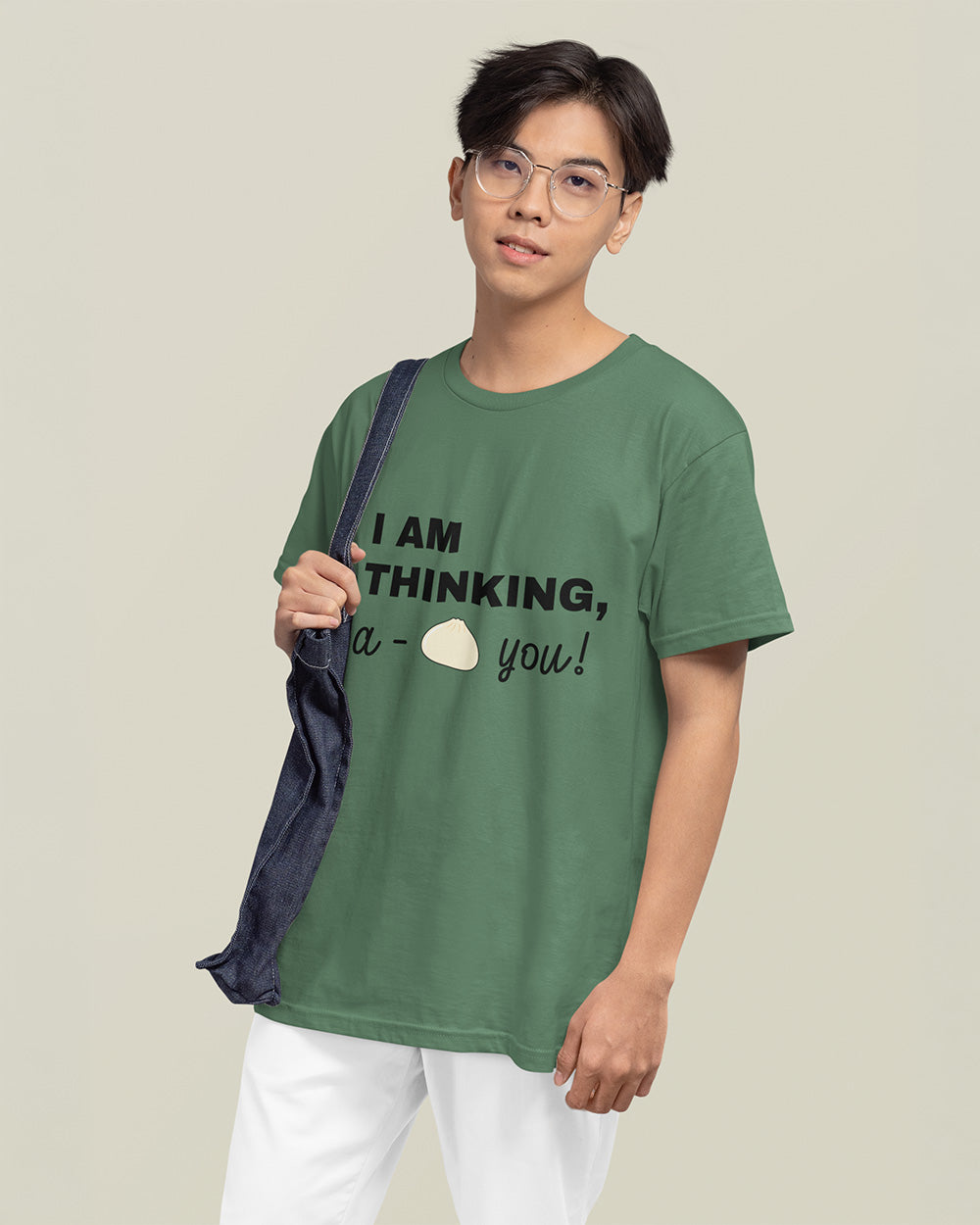 Male model showing relaxed fit light green kawaii food graphic t-shirt for modern teen and young adult streetwear.
