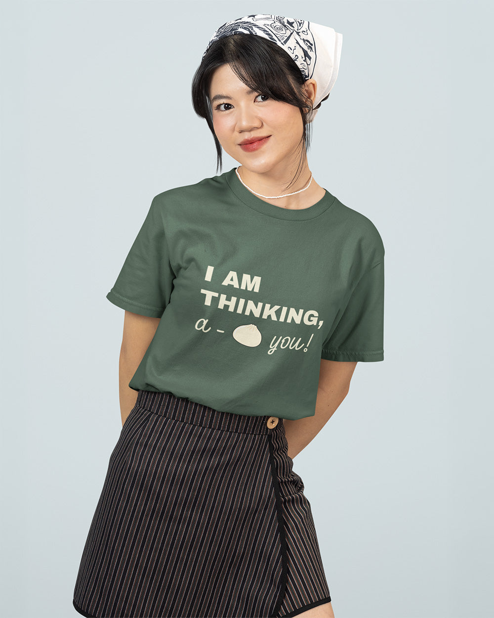 Female model wearing blue spruce kawaii bao bun graphic t-shirt for teen and young adult casual streetwear size guide.